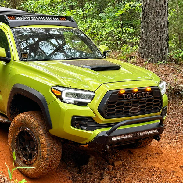 Running Car With CALI RAISED TOYOTA STEALTH BUMPER | 2016-2023 TACOMA (Secondary 32in SPOT BEAM with Relocation Mounts)