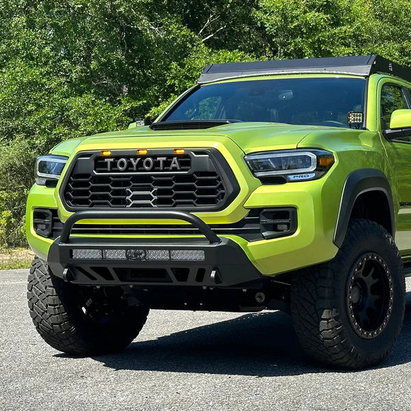 The Car On Road with Installed CALI RAISED TOYOTA STEALTH BUMPER | 2016-2023 TACOMA (Secondary 32in SPOT BEAM with Relocation Mounts)
