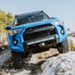 Car Leaned On Side with Installed Cali Raised Stealth Bumper Fits 2014+ Toyota 4Runner