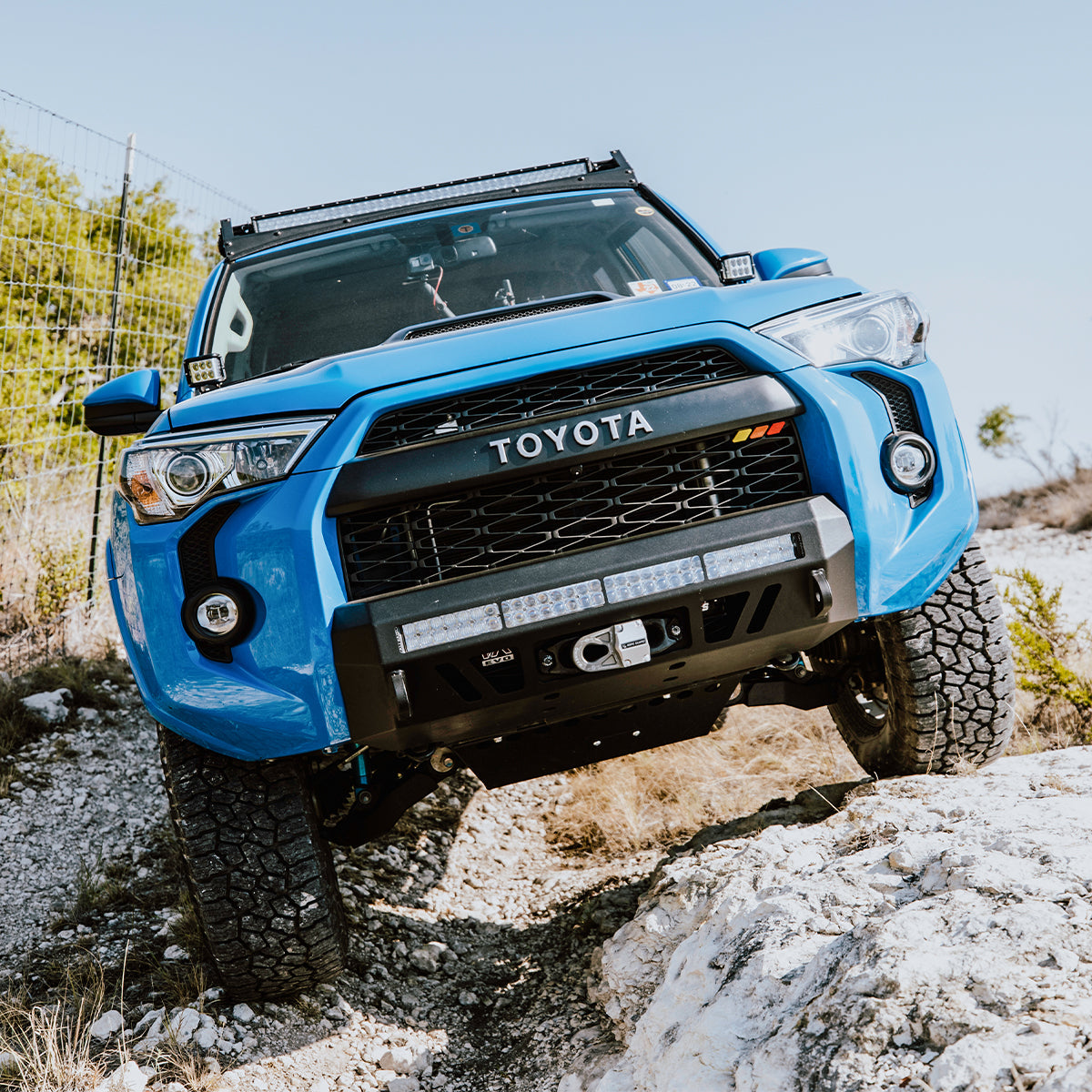 Car Leaned On Side with Installed Cali Raised Stealth Bumper Fits 2014+ Toyota 4Runner